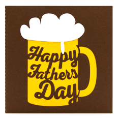 Handmade Father's Day card in the shape of a beer mug, featuring layered yellow and brown cardstock with white froth and the words "Happy Father's Day" cut into the mug design.