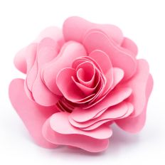 rolled paper flower with almost heart-shaped petals in soft pink