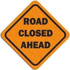 'road closed ahead' traffic sign