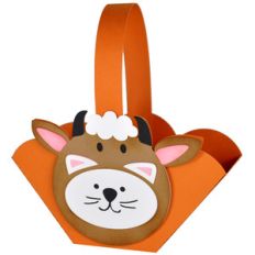 kitty in a cow costume halloween basket