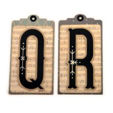 initial q r stitched pocket tag or card