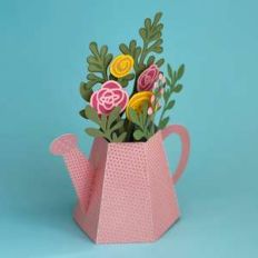 watering can with flowers