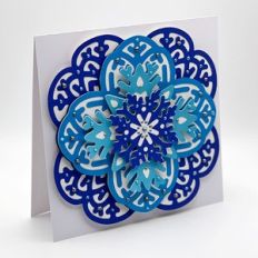 Christmas card with layered snowflake