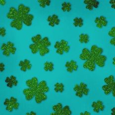 Embossed Teal with Green Glitter Shamrocks Background Pattern