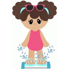 girl playing in sprinkler