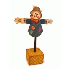 scarecrow with hay bale stand