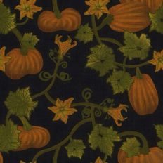 pumpkins on the vine with yellow squash blossoms