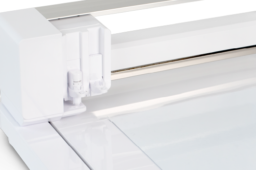 Close-up view of a white cutting machine