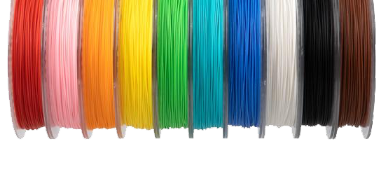 Spools of 3D printer filament in various colors including pink, orange, yellow, green, blue, white, black, and brown, arranged side by side.