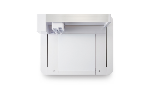 Top-down view of a white cutting machine with an open lid